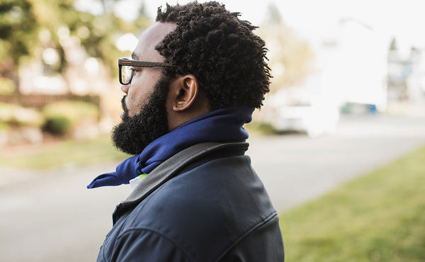 A person wearing the Shepherd's Wool Utility Cloth as a kerchief.